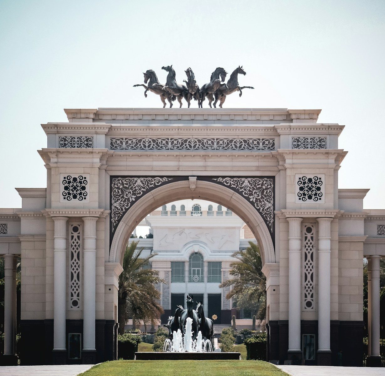 people sitting on bench near building during daytime